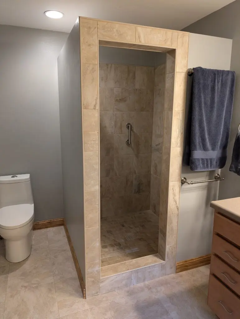 New custom tile shower with handle for balance